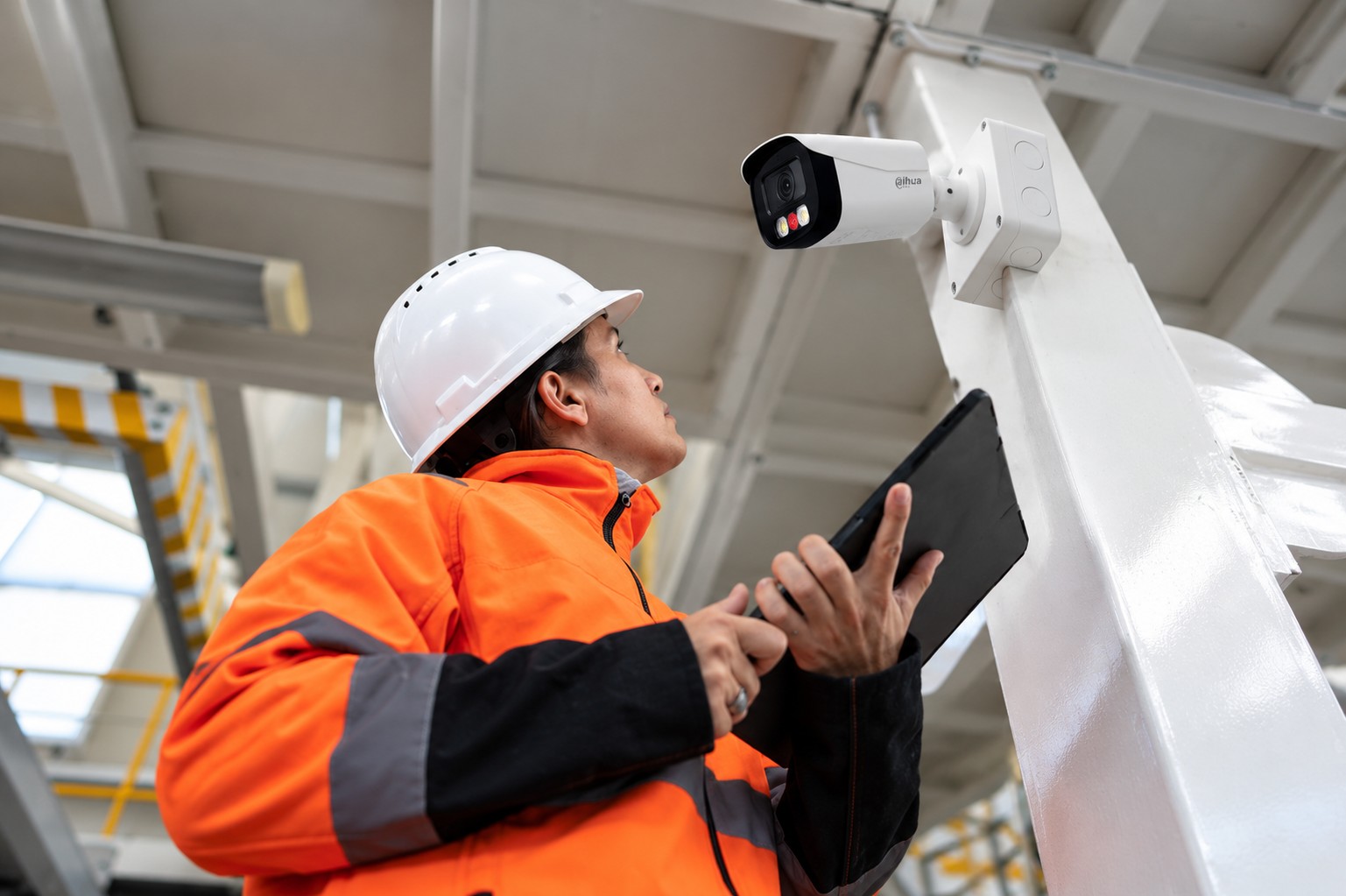 CCTV INSTALLATION MELBOURNE technician installing a security camera